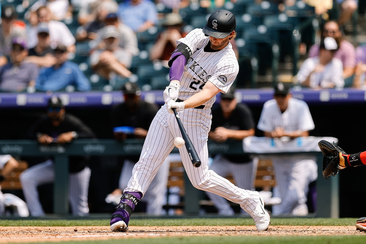  Colorado Rockies third baseman Ryan McMahon (24) hits a two run home run in the fourth inning against the Boston Red Sox at Coors Field.