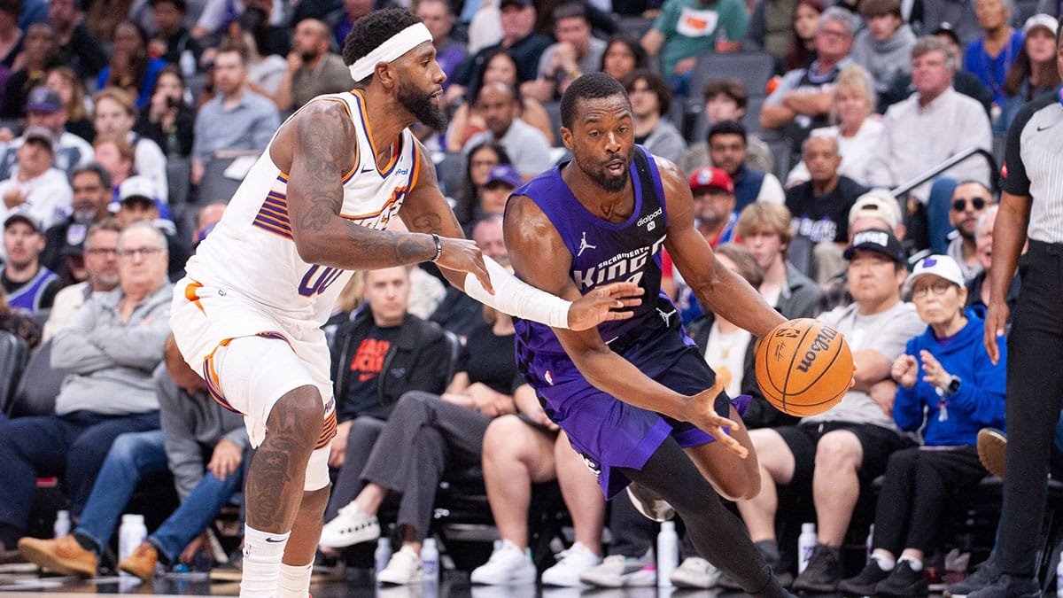 Apr 12, 2024; Sacramento, California, USA; Sacramento Kings forward Harrison Barnes (40) drives to the basket against Phoenix Suns forward Royce O'Neale (00) during the fourth quarter at Golden 1 Center. Mandatory Credit: Ed Szczepanski-USA TODAY Sports