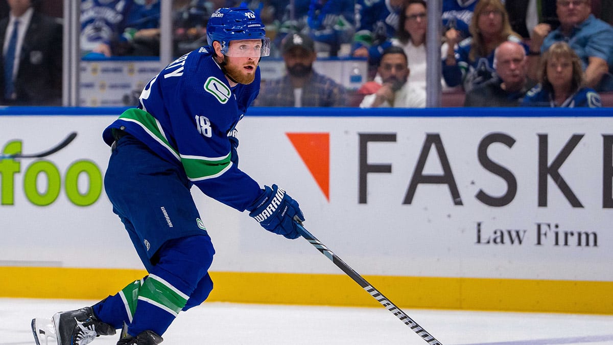Vancouver Canucks forward Sam Lafferty (18) handles the puck against the Edmonton Oilers during the third period in game two of the second round of the 2024 Stanley Cup Playoffs at Rogers Arena.