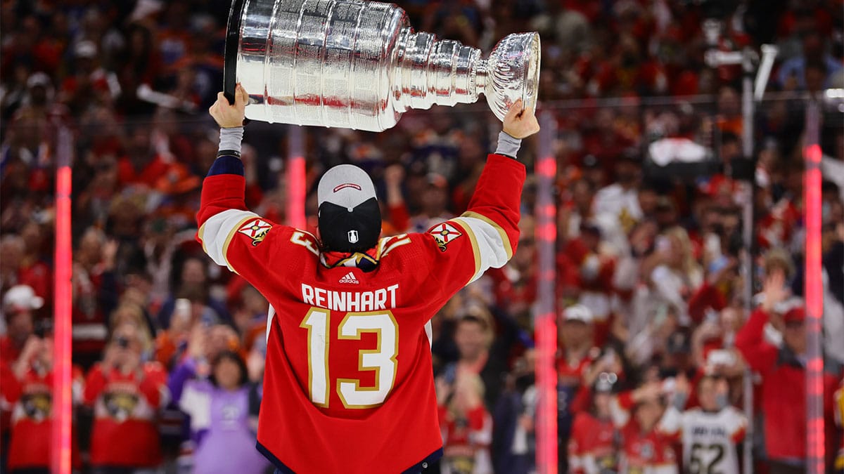 Florida Panthers center Sam Reinhart (13) lifts the cup after winning game seven of the 2024 Stanley Cup Final against the Edmonton Oilers at Amerant Bank Arena.