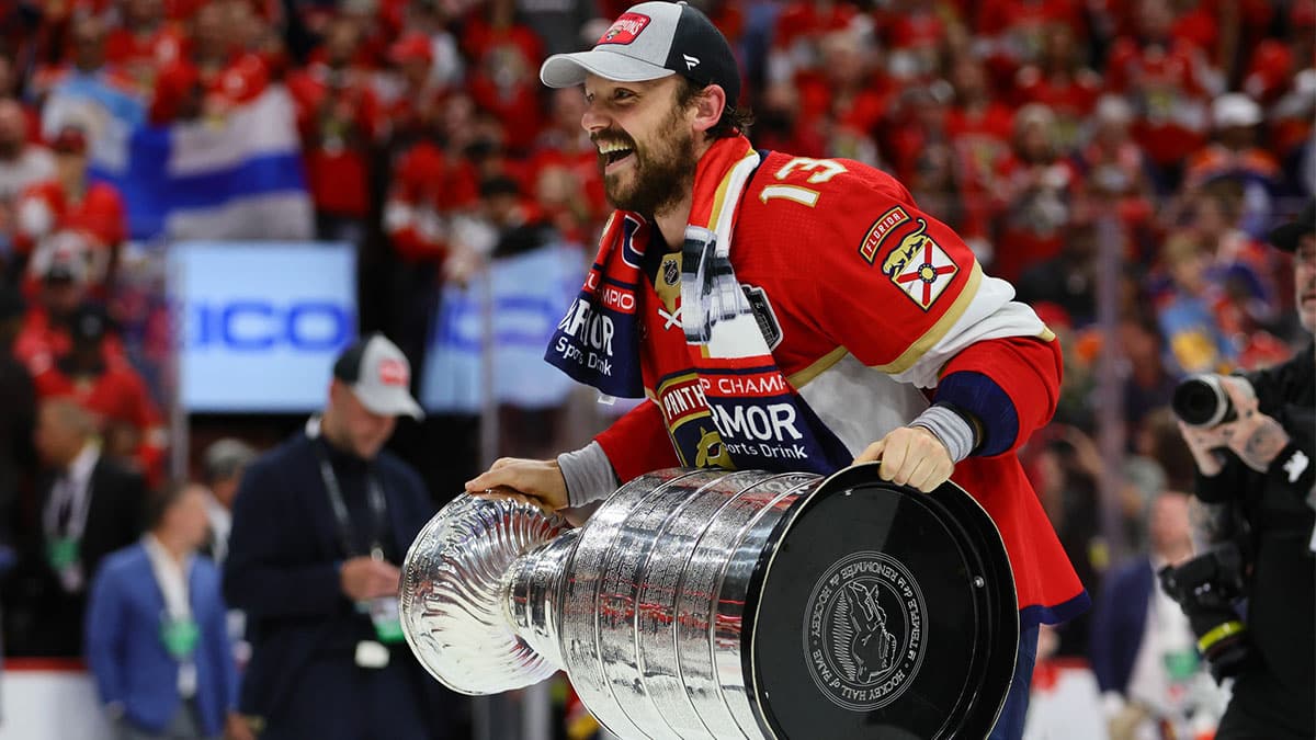 Florida Panthers center Sam Reinhart (13) skates with the cup after winning game seven of the 2024 Stanley Cup Final against the Edmonton Oilers at Amerant Bank Arena.