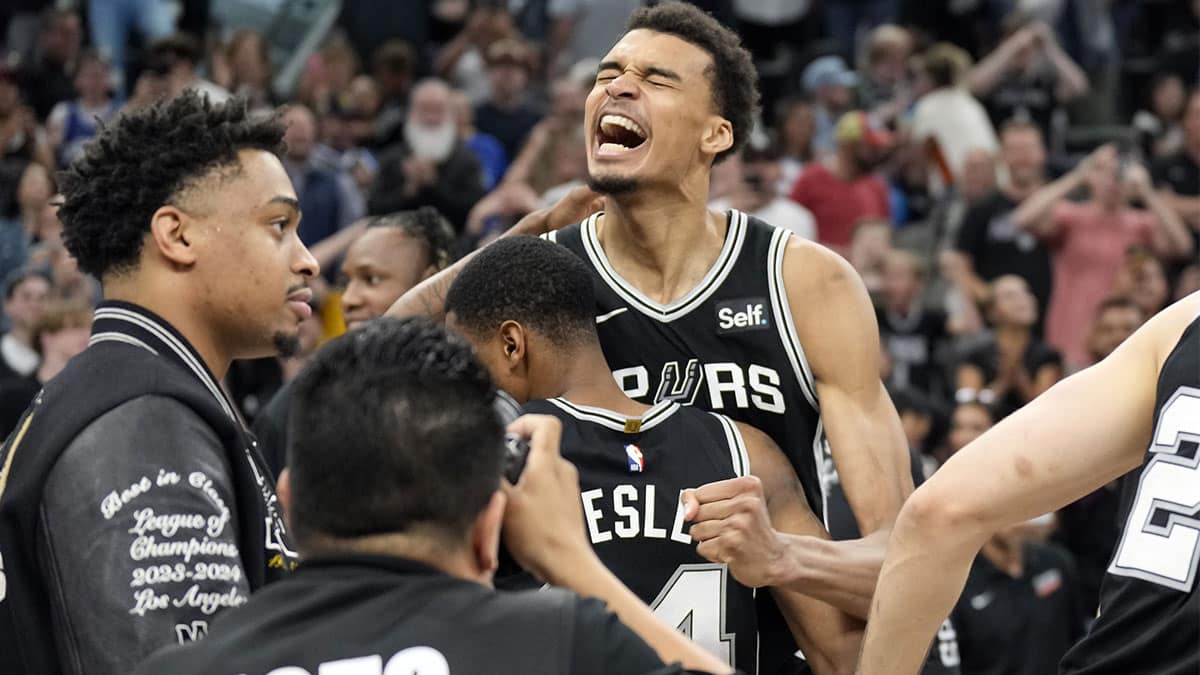 San Antonio Spurs forward Victor Wembanyama (1) and teammates react after a victory over the Denver Nuggets at Frost Bank Center. 