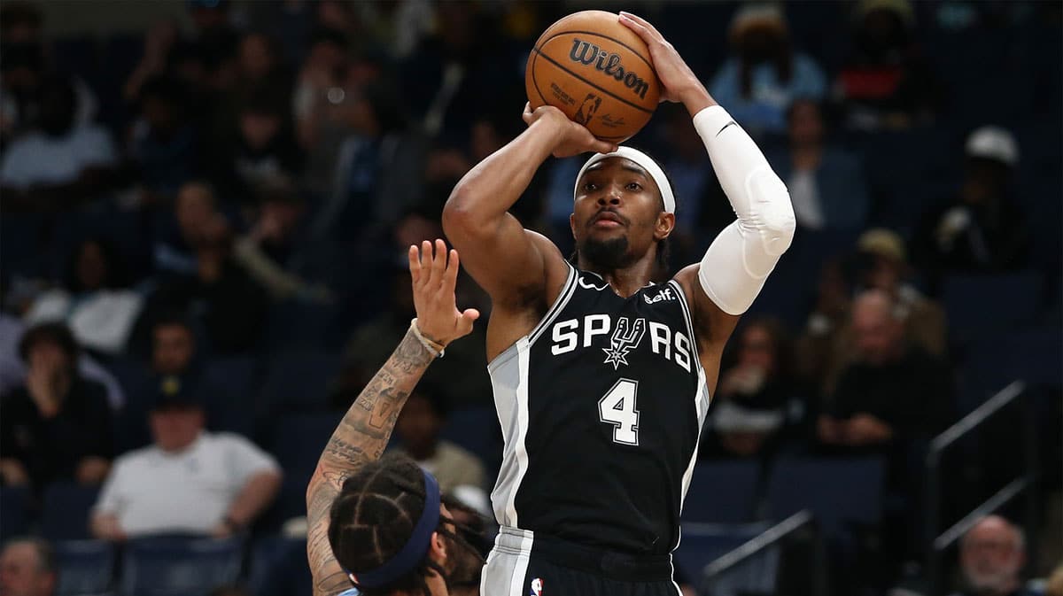 San Antonio Spurs guard Devonte' Graham (4) shoots during the second half against the Memphis Grizzlies at FedExForum.