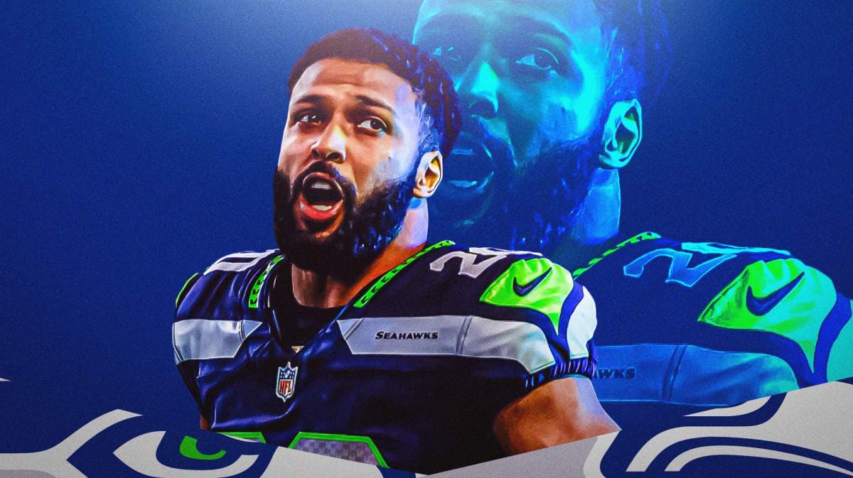 Julian Love celebrating wearing Seahawks uniform.