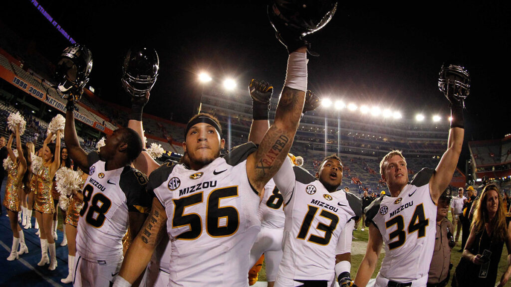 Missouri Tigers defensive lineman Shane Ray (56), wide receiver Jimmie Hunt (88), offensive lineman Evan Boehm (77), safety Chaston Ward (13) and teammates celebrate after they beat the Florida Gators during the second half at Ben Hill Griffin Stadium. Missouri Tigers defeated the Florida Gators 42-13. 