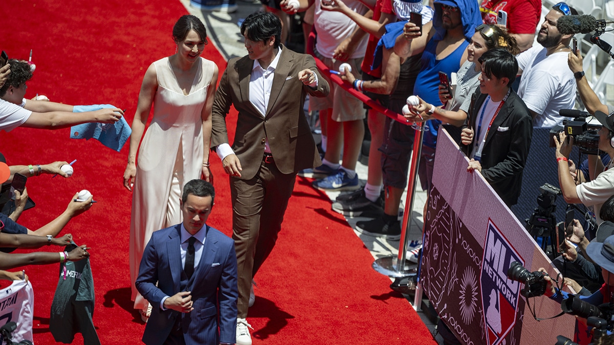 National League designated hitter Shohei Ohtani of the Los Angeles Dodgers (17) and his wife Mamiko Tanaka walk the red carpet before the 2024 MLB All-Star game at Globe Life Field. 