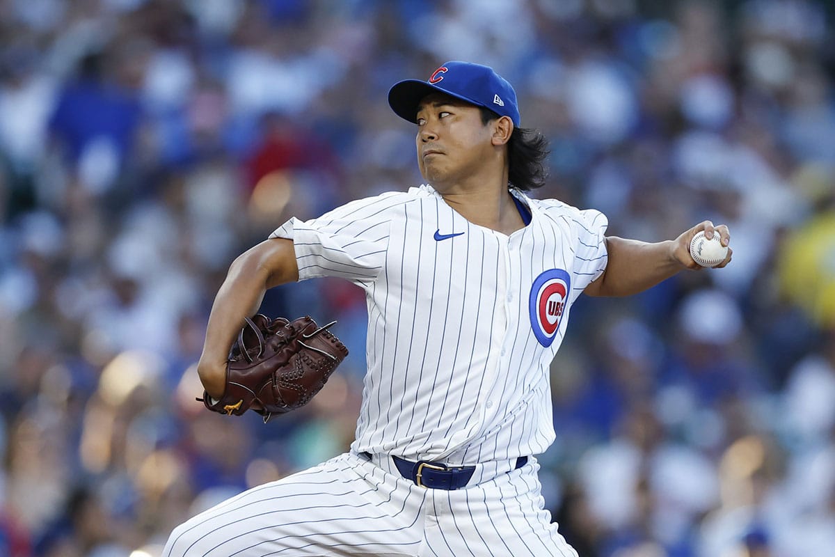 Chicago Cubs starting pitcher Shota Imanaga (18) delivers a pitch against the Philadelphia Phillies during the first inning at Wrigley Field.