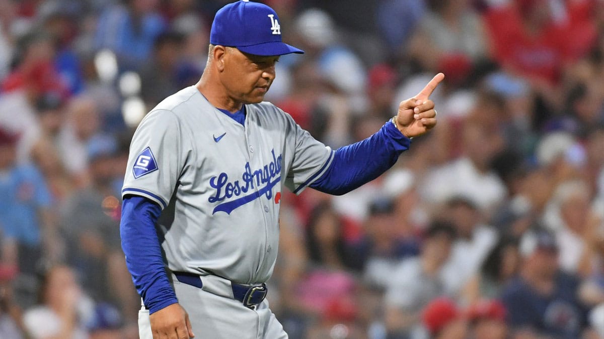 Los Angeles Dodgers manager Dave Roberts (30) signals to the bullpen to make a pitching change against the Philadelphia Phillies at Citizens Bank Park.