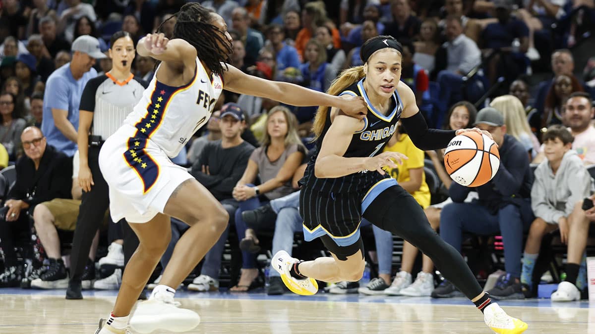 Chicago Sky guard Chennedy Carter (7) drives to the basket against Indiana Fever guard Kelsey Mitchell (0)