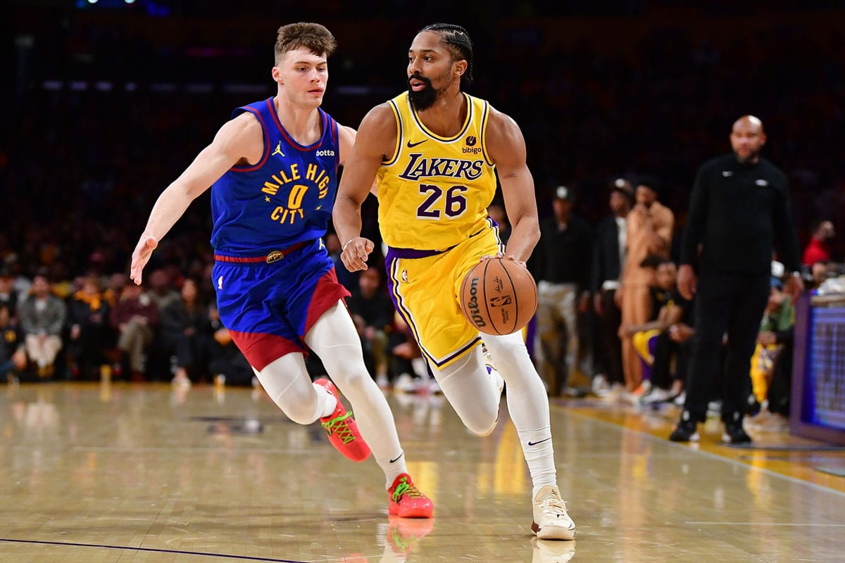 Los Angeles Lakers guard Spencer Dinwiddie (26) moves the ball ahead of Denver Nuggets guard Christian Braun (0) during the second half in game three of the first round for the 2024 NBA playoffs at Crypto.com Arena.