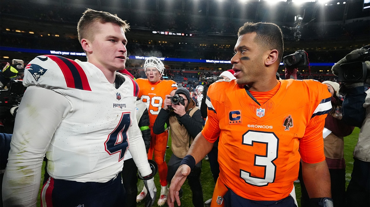  New England Patriots quarterback Bailey Zappe (4) and Denver Broncos quarterback Russell Wilson (3) following the game at Empower Field at Mile High. 