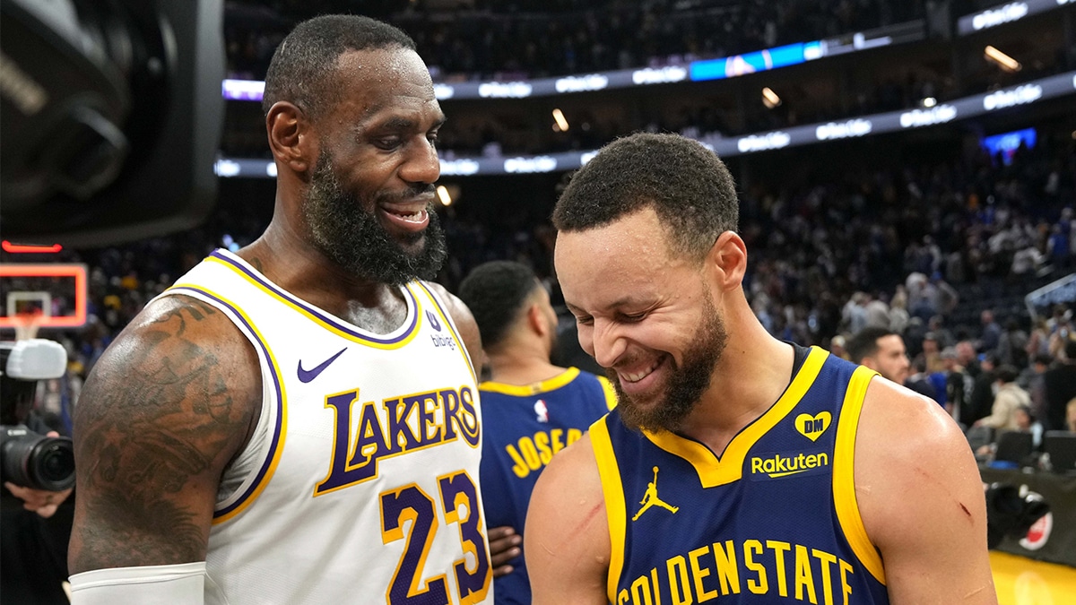 Los Angeles Lakers forward LeBron James (23) and Golden State Warriors guard Stephen Curry (right) talk after the game at Chase Center. 