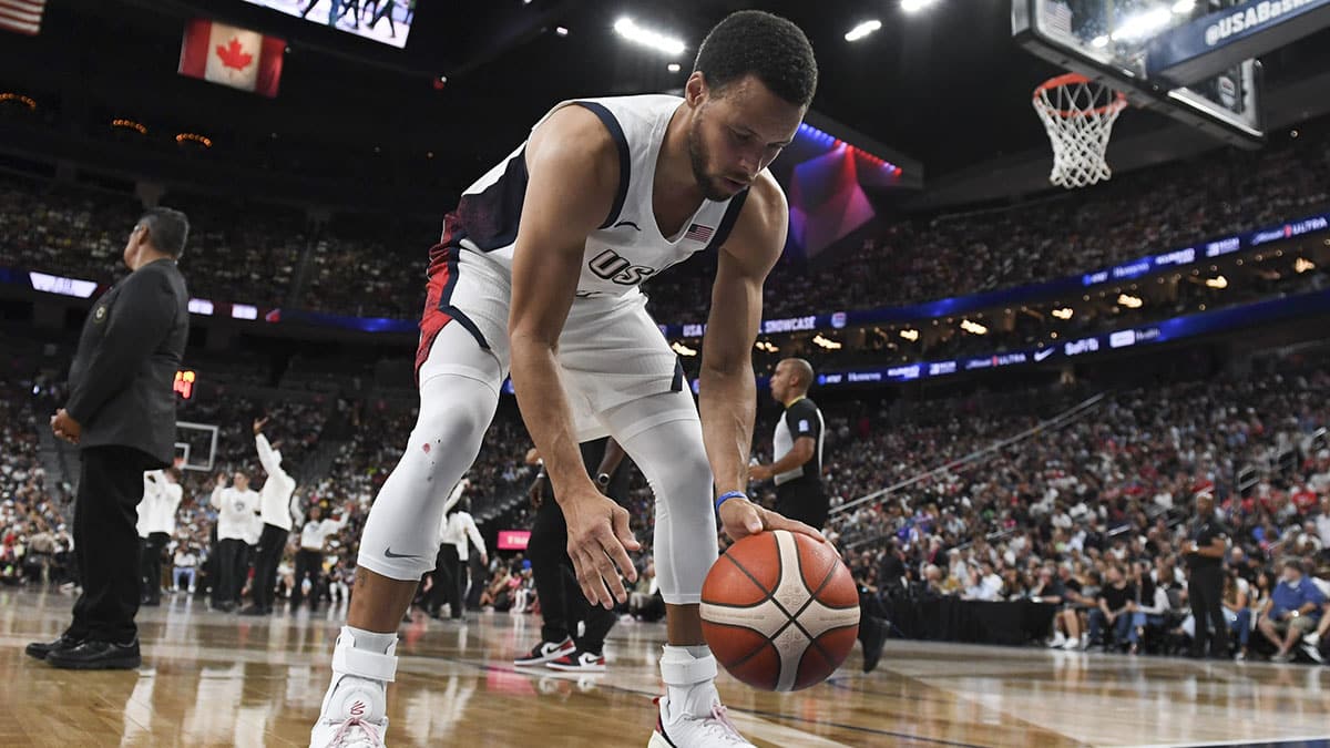 USA guard Stephen Curry (4) practices his dribbling during a timeout against Canada in the fourth quarter of the USA Basketball Showcase at T-Mobile Arena. 