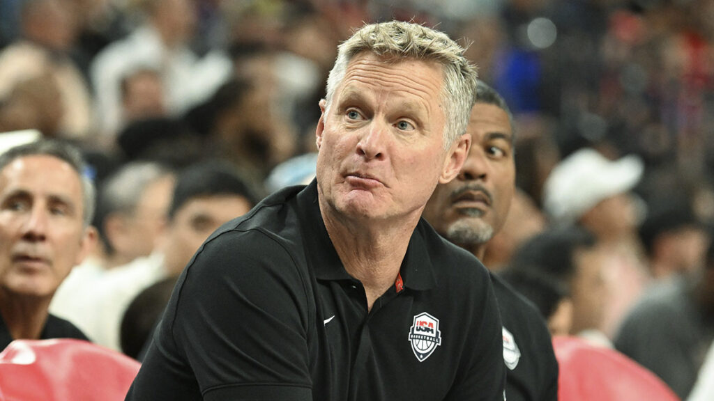 USA head coach Steve Kerr speaks to a player on the bench in the fourth quarter against Canada in the USA Basketball Showcase at T-Mobile Arena.