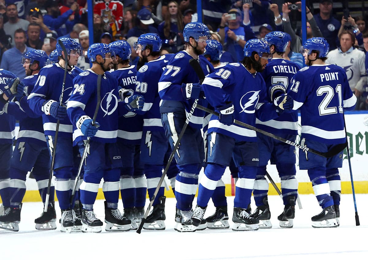 Tampa Bay Lightning left wing Anthony Duclair (10), defenseman Victor Hedman (77), center Brayden Point (21) and teammates celebrate after they beat the Florida Panthers in game four of the first round of the 2024 Stanley Cup Playoffs at Amalie Arena.