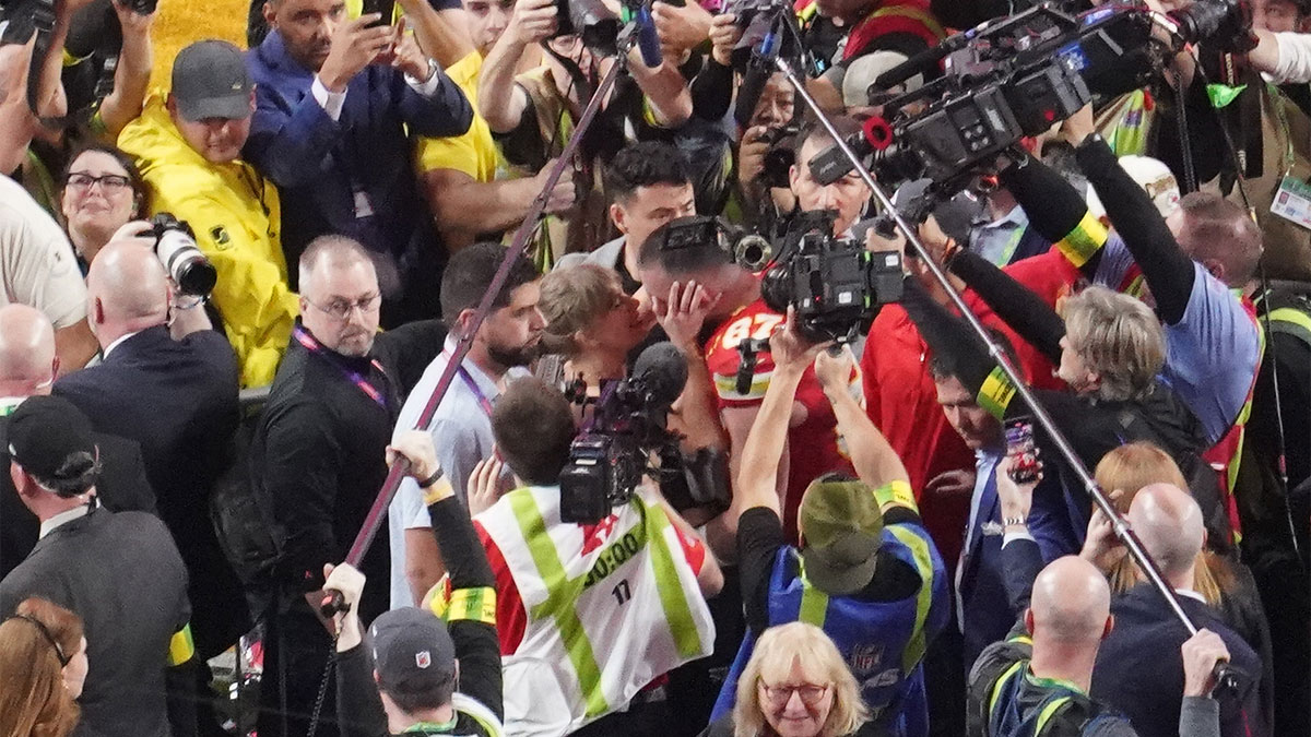 Taylor Swift and Travis Kelce kissing after Super Bowl LVIII.