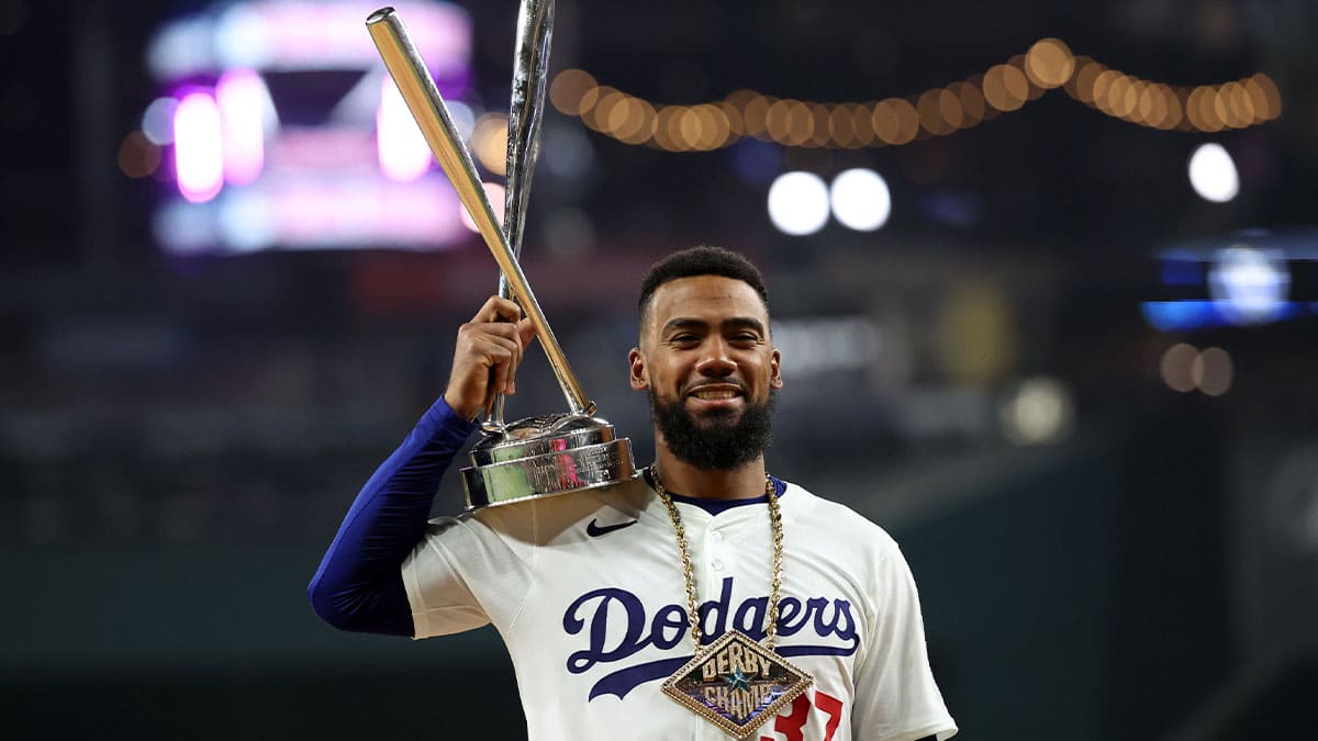 National League outfielder Teoscar Hernandez of the Los Angeles Dodgers (37) poses with the trophy after winning the 2024 Home Run Derby at Globe Life Field