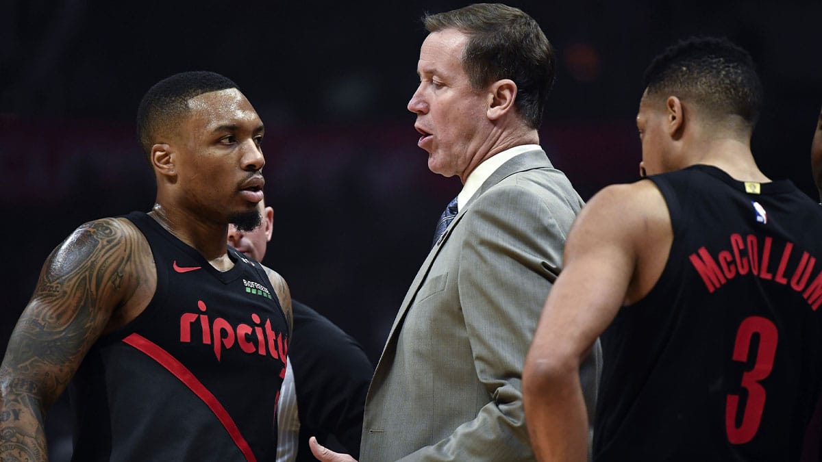  Portland Trail Blazers head coach Terry Stotts talks to Portland Trail Blazers guards Damian Lillard (0) and CJ McCollum (3) during the second quarter against the Los Angeles Clippers at Staples Center. 