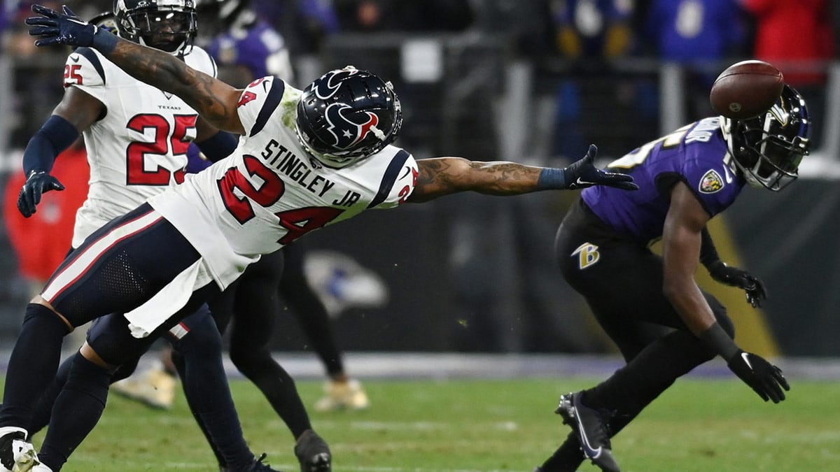 Houston Texans cornerback Derek Stingley Jr. (24) reaches for a pass against the Baltimore Ravens during the second quarter of a 2024 AFC divisional round game at M&T Bank Stadium.