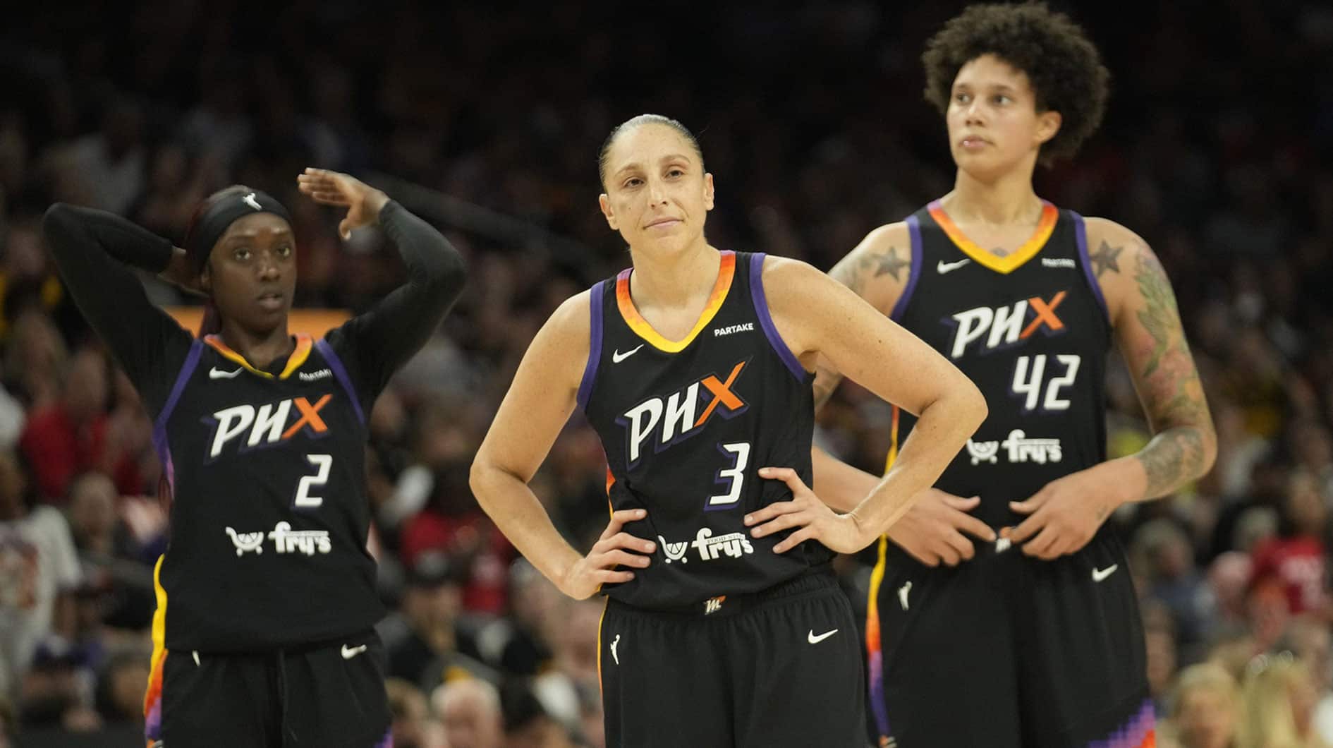 Phoenix Mercury guards Kahleah Copper (2) and Diana Taurasi (3) and center Brittney Griner (42) wait for free throws during the fourth quarter against the Indiana Fever at Footprint Center.