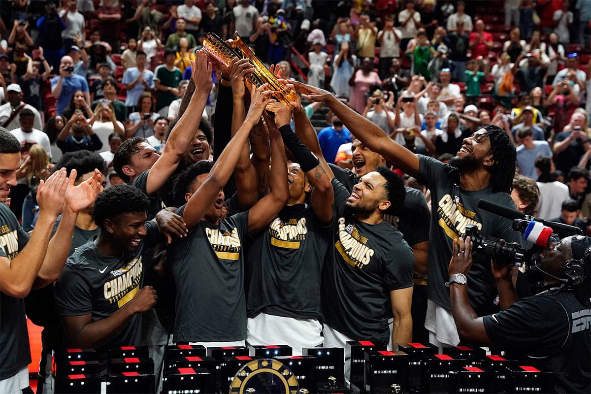 Miami Heat lift the 2025 Summer League Champions trophy after defeating the Memphis Grizzlies in overtime at Thomas & Mack Center.