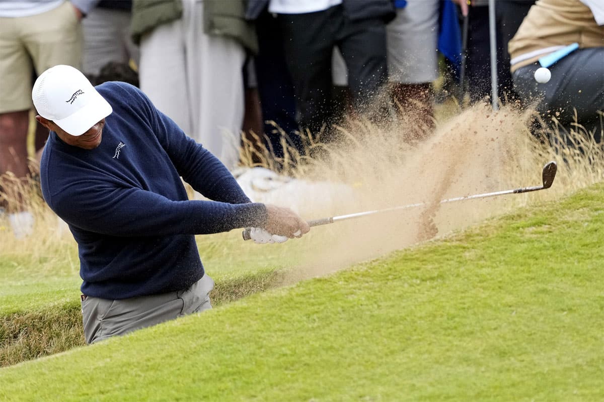 Tiger Woods plays a shot from a bunker on the 12th hole during the second round of the Open Championship golf tournament at Royal Troon.
