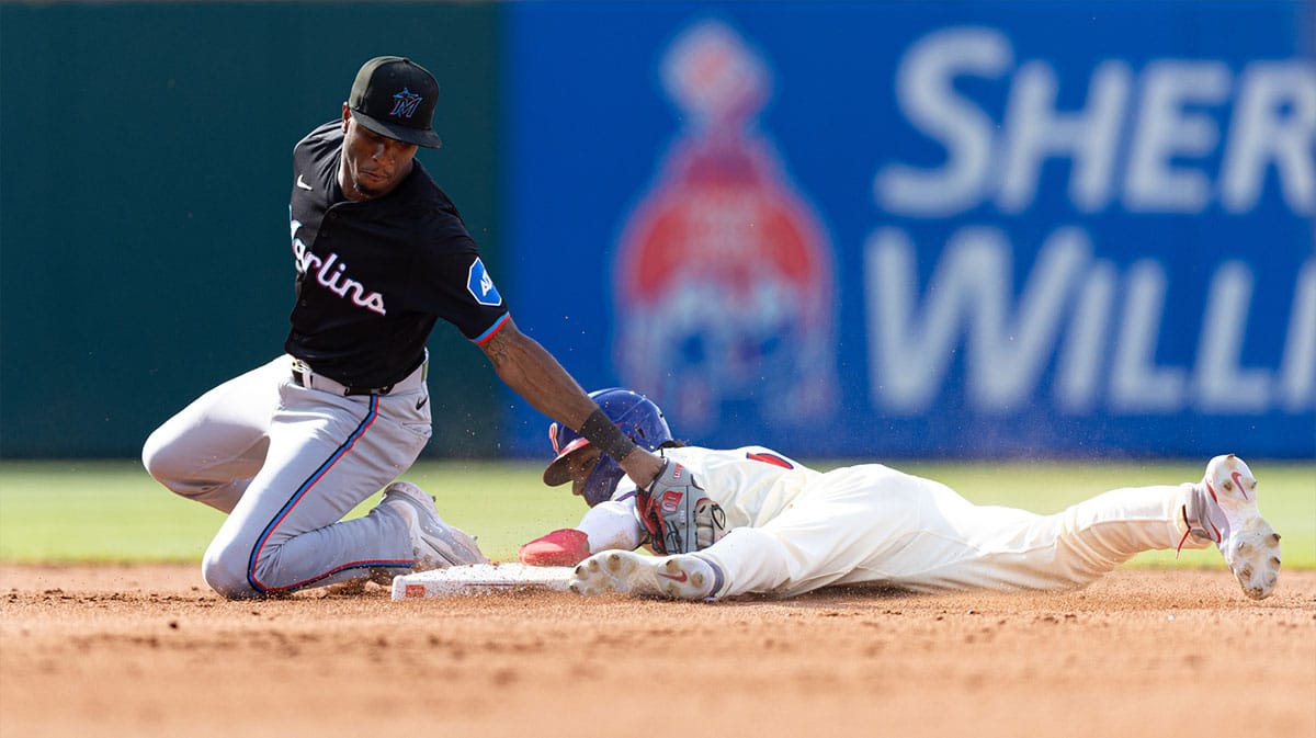 Philadelphia Phillies outfielder Johan Rojas (18) steals second base past Miami Marlins shortstop Tim Anderson (7) during the fifth inning at Citizens Bank Park.