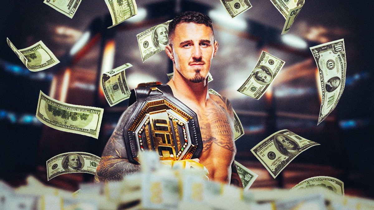 Tom Aspinall with money all around him