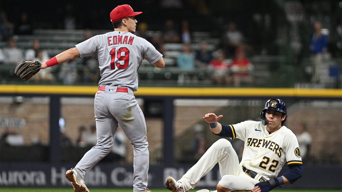 St. Louis Cardinals shortstop Tommy Edman (19) forces out Milwaukee Brewers left fielder Christian Yelich (22) and completes the double play in the fifth inning at American Family Field.