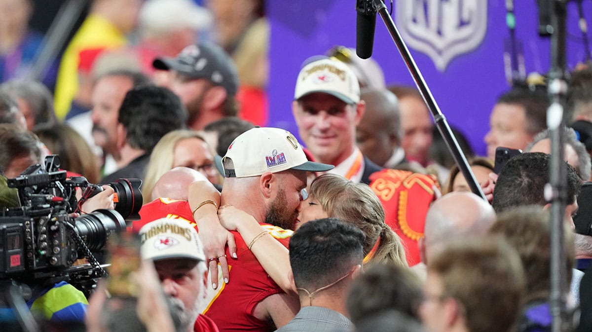 Travis Kelce, Taylor Swift kissing after the Chiefs won Super Bowl LVIII.