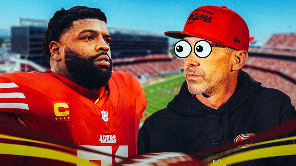 Kyle Shanahan with big eyes looking at Trent Williams