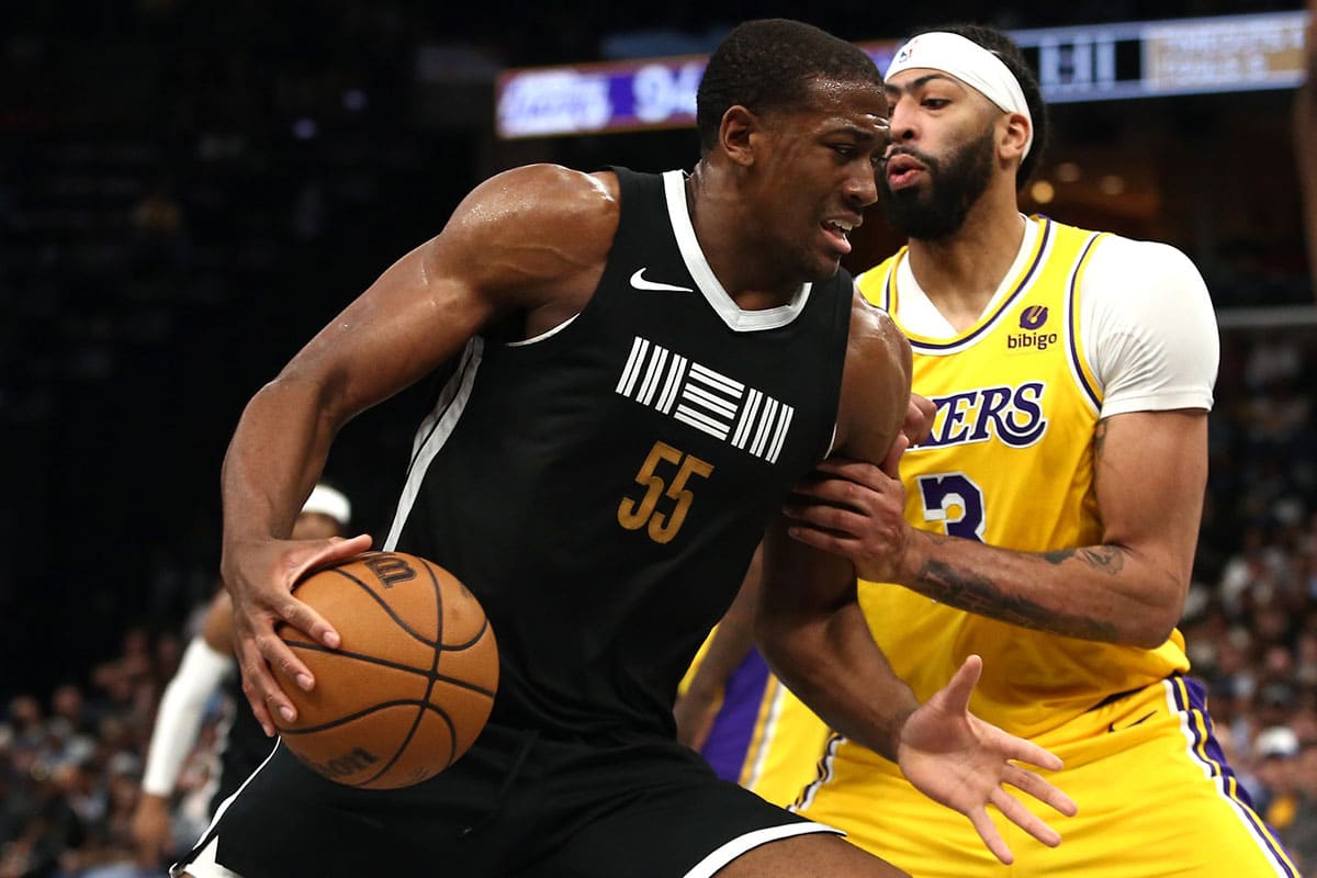 Memphis Grizzlies center Trey Jemison (55) drives to the basket as Los Angeles Lakers forward Anthony Davis (3) defends during the second half at FedExForum.