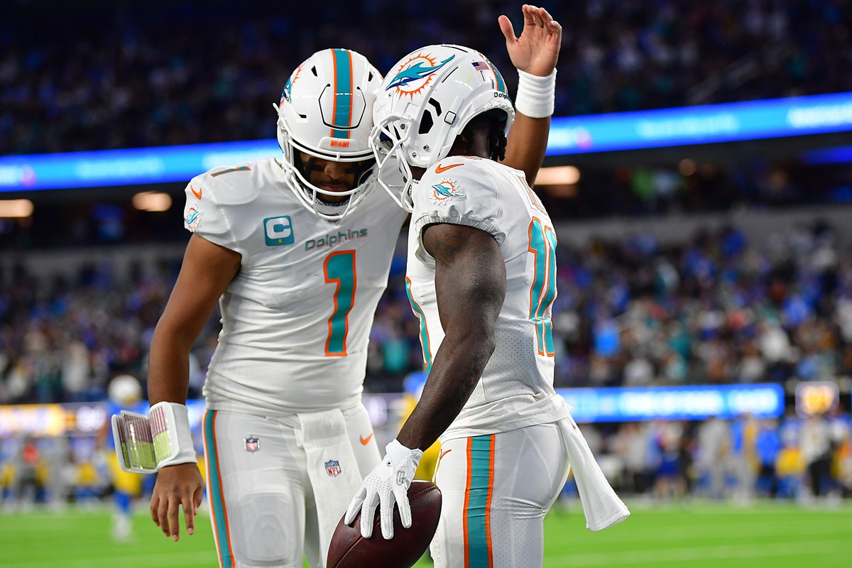 Miami Dolphins wide receiver Tyreek Hill (10) celebrates his touchdown scored against the Los Angeles Chargers with quarterback Tua Tagovailoa (1) during the first half at SoFi Stadium.