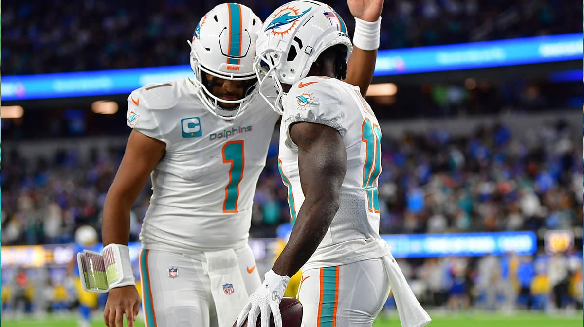 Miami Dolphins wide receiver Tyreek Hill (10) celebrates his touchdown scored against the Los Angeles Chargers with quarterback Tua Tagovailoa (1) during the first half at SoFi Stadium.