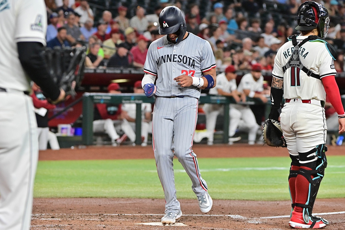 Minnesota Twins third base Royce Lewis (23) scores in the second inning against the Arizona Diamondbacks at Chase Field. 