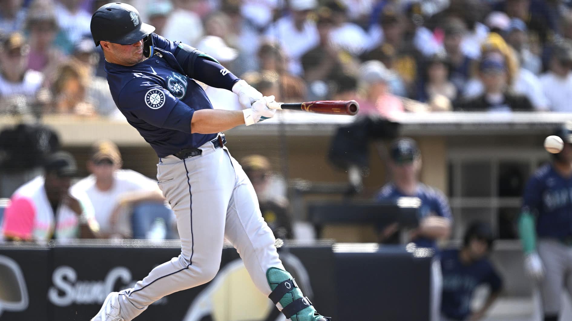 Jul 10, 2024; San Diego, California, USA; Seattle Mariners first baseman Ty France (23) hits a single against the San Diego Padres during the fourth inning at Petco Park. 