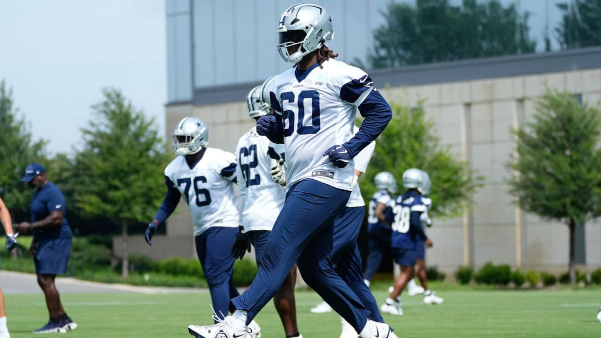 Jun 5, 2024; Frisco, TX, USA; Dallas Cowboys tackle Tyler Guyton (60) goes through a drill during practice at the Ford Center at the Star Training Facility in Frisco, Texas.