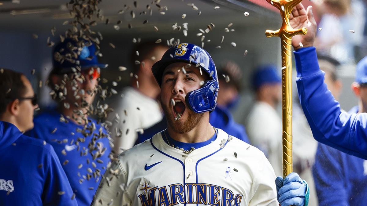 Jun 16, 2024; Seattle, Washington, USA; Seattle Mariners first baseman Tyler Locklear (27) celebrates in the dugout with after hitting a solo-home run against the Texas Rangers during the seventh inning at T-Mobile Park. Mandatory Credit: Joe Nicholson-USA TODAY Sports
