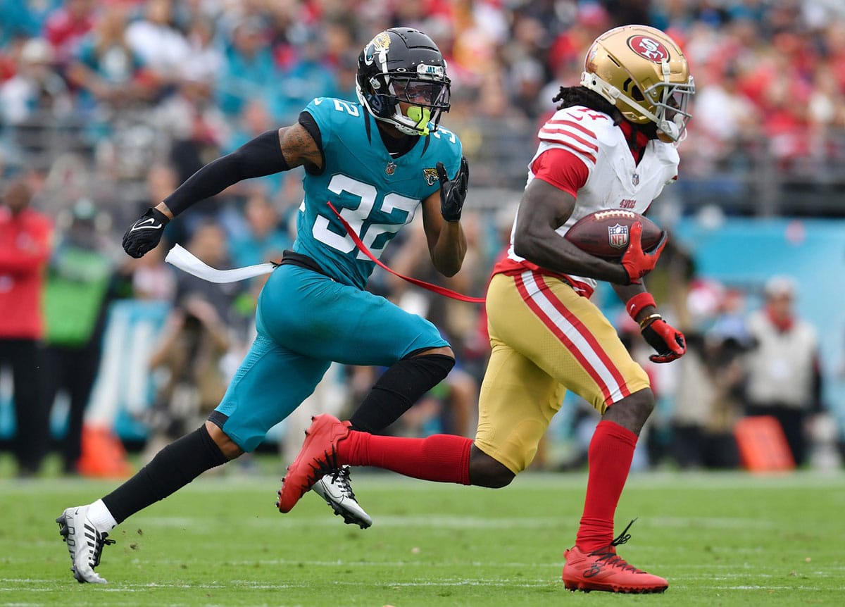 Jacksonville Jaguars cornerback Tyson Campbell (32) chases down San Francisco 49ers wide receiver Brandon Aiyuk (11) on a late first quarter pass play. The Jacksonville Jaguars hosted the San Francisco 49ers at EverBank Stadium in Jacksonville, FL Sunday, November 12, 2023. The Jaguars trailed 13 to 3 at the half. [Bob Self/Florida Times-Union]