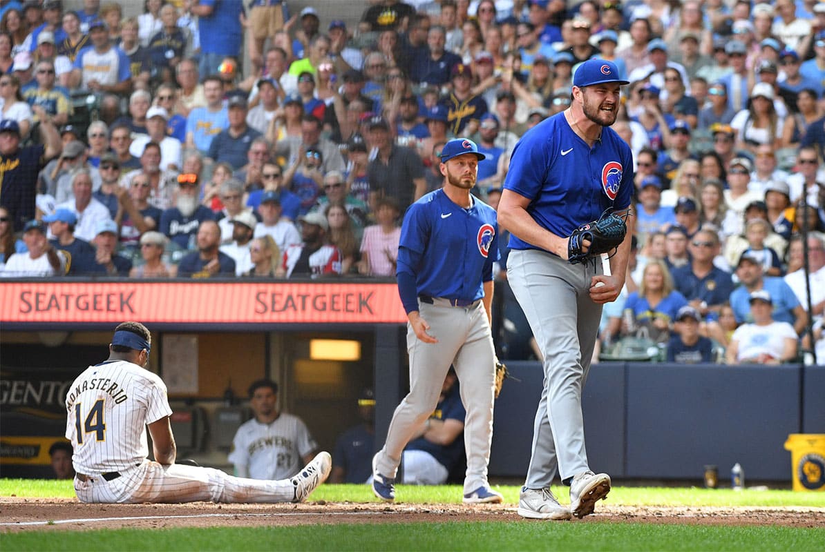 Chicago Cubs relief pitcher Tyson Miller (49) reacts after tagging out Milwaukee Brewers second baseman Andruw Monasterio (14) at home plate after a rundown in the seventh inning at American Family Field.