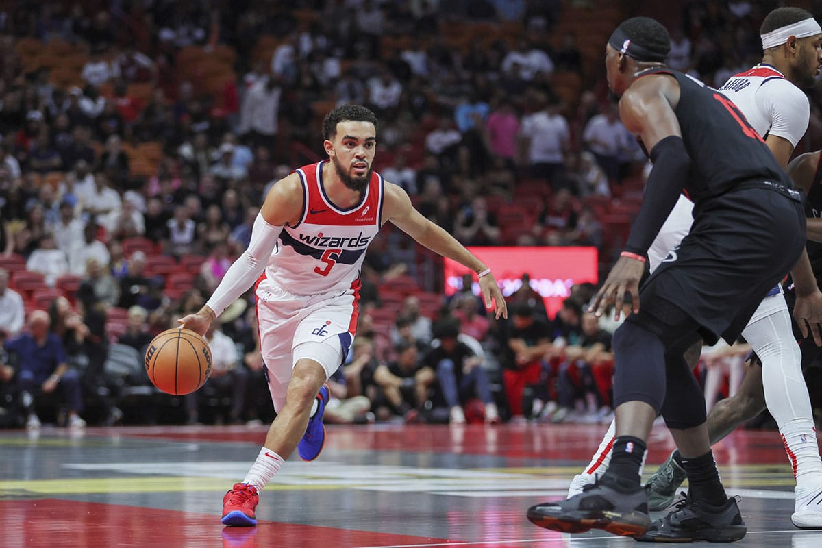 Washington Wizards guard Tyus Jones (5) drives to the basket against the Miami Heat during the first quarter at Kaseya Center. 