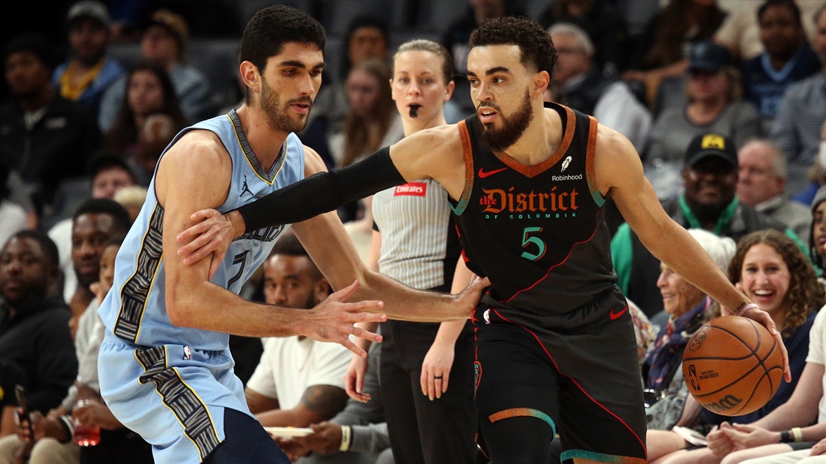 Washington Wizards guard Tyus Jones (5) dribbles as Memphis Grizzlies forward-center Santi Aldama (7) defends during the second half at FedExForum.