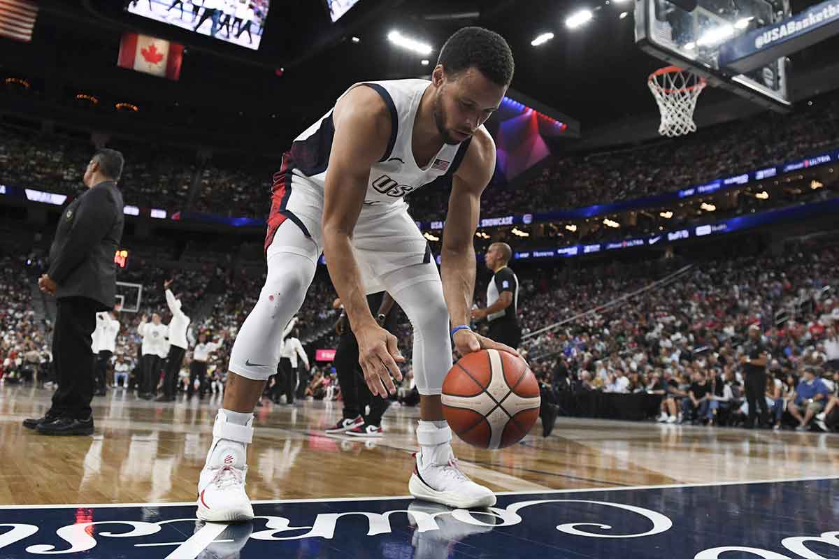Jul 10, 2024; Las Vegas, Nevada, USA; USA guard Stephen Curry (4) practices his dribbling during a timeout against Canada in the fourth quarter of the USA Basketball Showcase at T-Mobile Arena. Mandatory Credit: Candice Ward-USA TODAY Sports