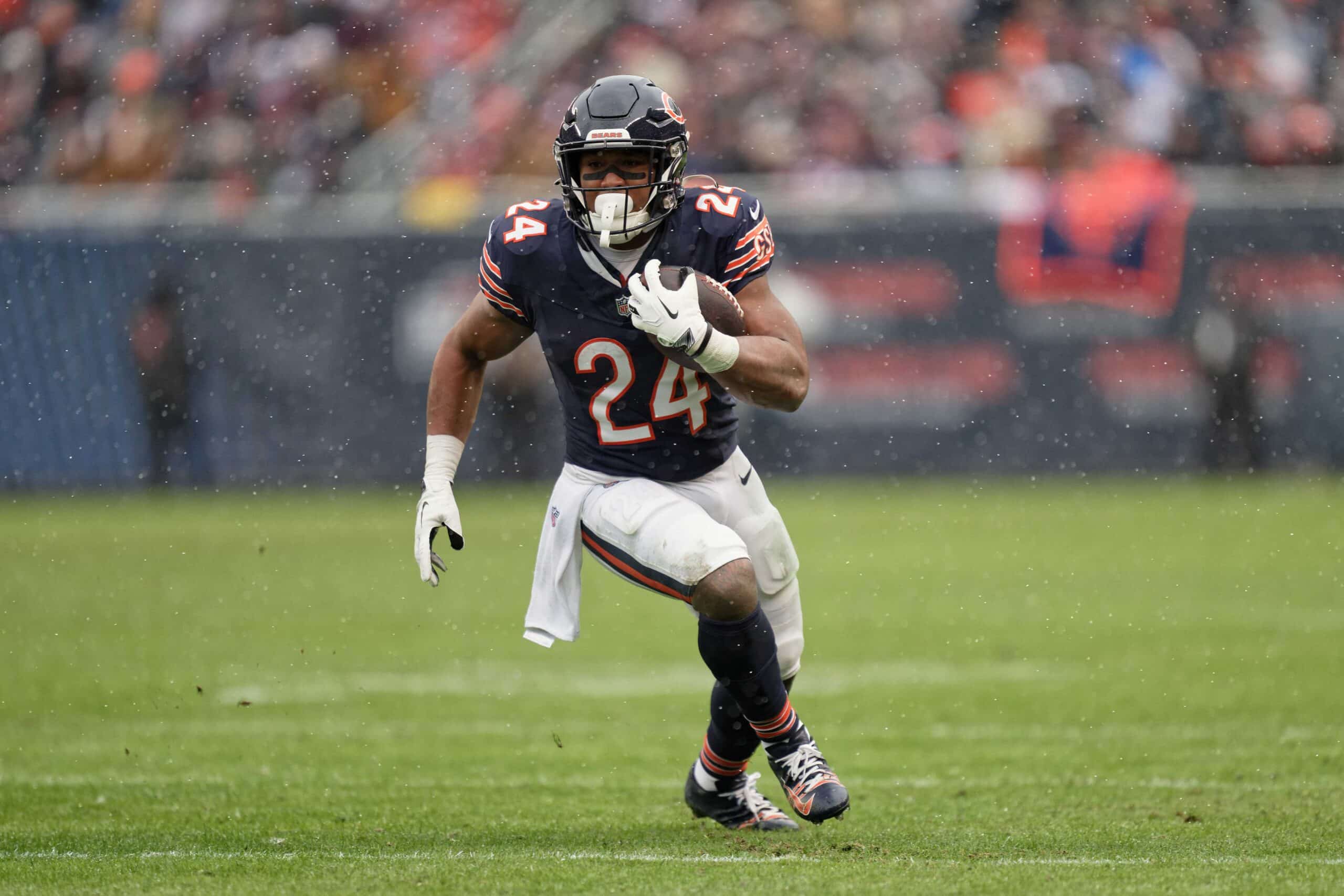 Dec 31, 2023; Chicago, Illinois, USA; Chicago Bears running back Khalil Herbert (24) runs with the ball against the Atlanta Falcons at Soldier Field. 