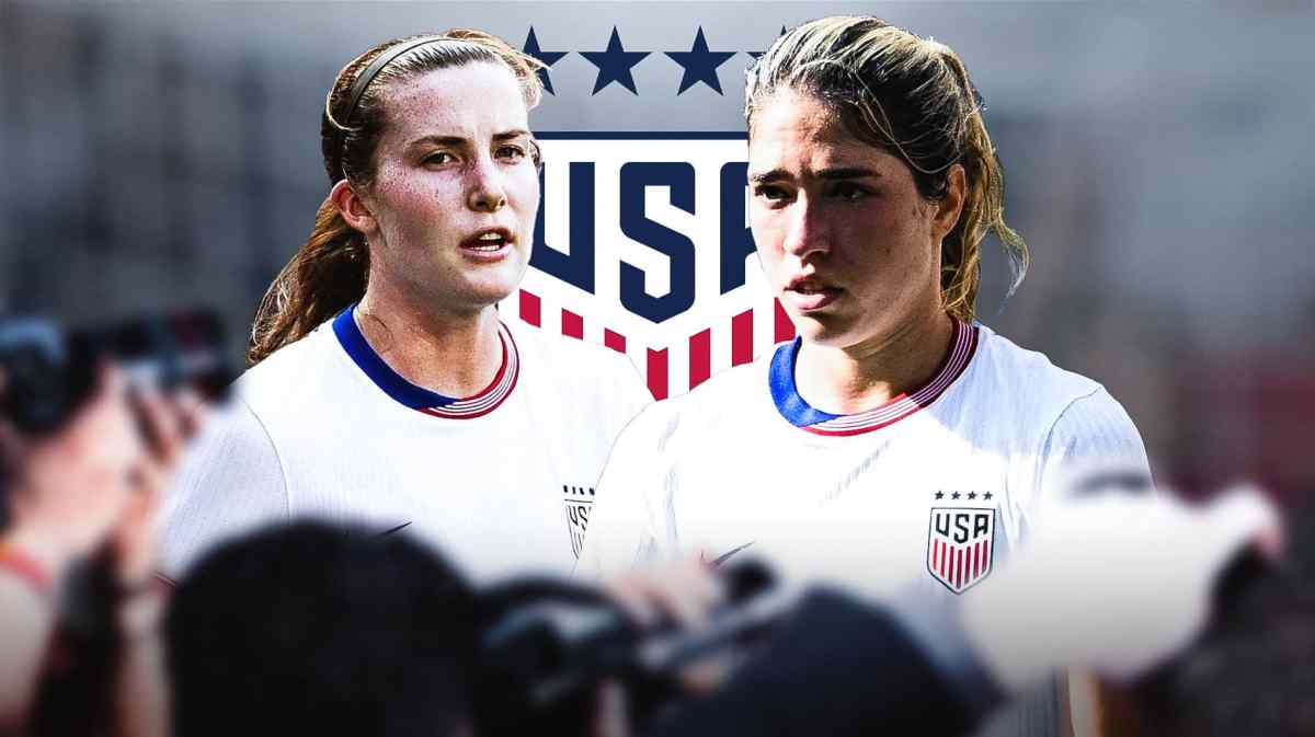 Korbin Albert and Tierna Davidson in front of the USWNT logo