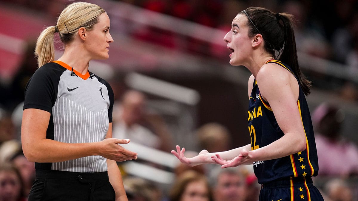 Indiana Fever guard Caitlin Clark (22) speaks with an official Wednesday, July 10, 2024, during the game at Gainbridge Fieldhouse in Indianapolis. The Mystics defeated the Fever, 89-84.
