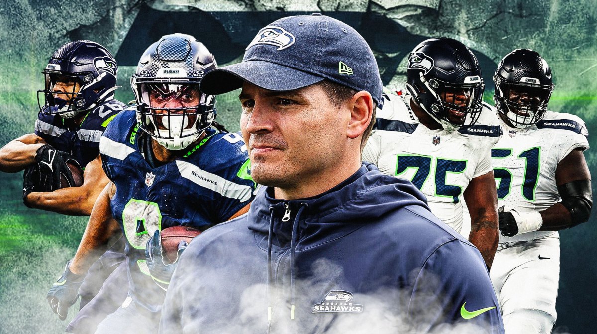 Coach Mike Macdonald in the middle, Anthony Bradford, Olu Oluwatimi, Kenneth Walker III, Zach Charbonnet, Seattle Seahawks wallpaper in the background