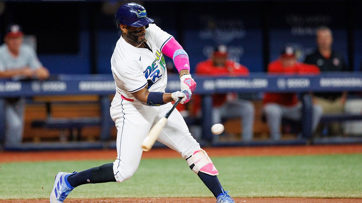 Jun 28, 2024; St. Petersburg, Florida, USA; Tampa Bay Rays first base Yandy Diaz (2) hits a base hit against the Washington Nationals in the third inning at Tropicana Field. 