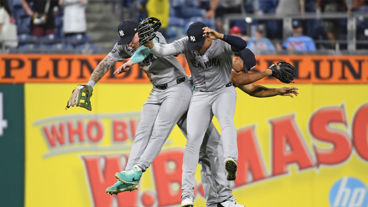 New York Yankees outfielder Alex Verdugo (24), outfielder Juan Soto (22) and outfielder Trent Grisham (12) celebrate win against the Philadelphia Phillies at Citizens Bank Park.