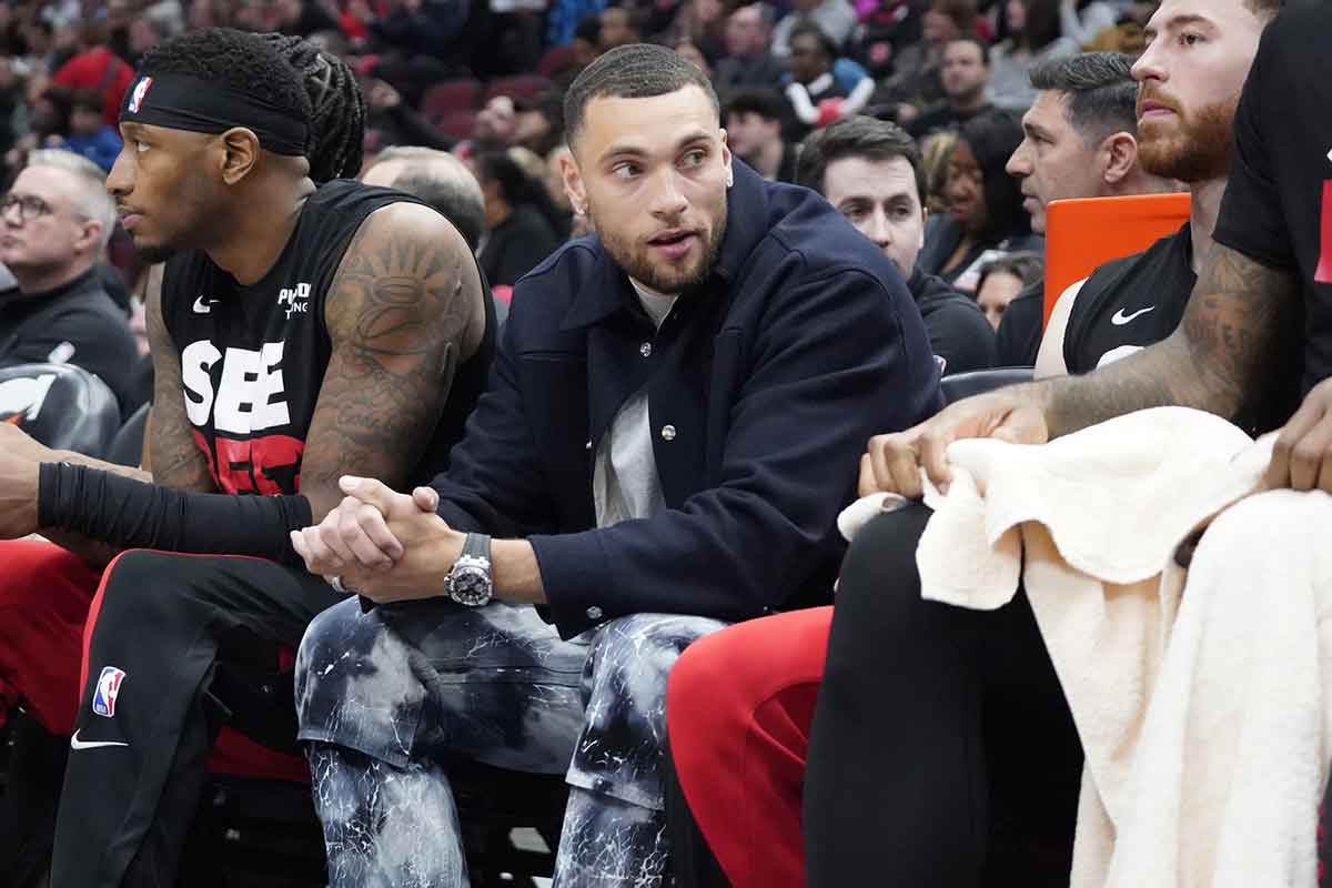 Chicago Bulls guard Zach LaVine (8) sits on the bench in street clothes during the first quarter at United Center
